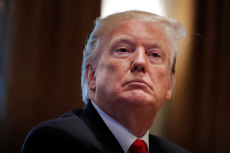 U.S. President Donald Trump listens during a Cabinet meeting on day 12 of the partial U.S. government shutdown at the White House in Washington, U.S., January 2, 2019. REUTERS/Jim Young