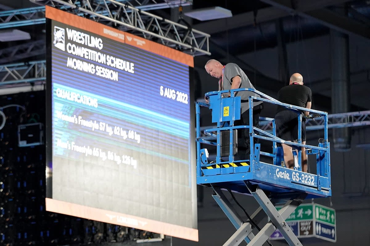 Staff carry out safety checks at the Coventry Arena after a speaker cover fell from the roof at Friday morning’s wrestling session, forcing a delay in the action (Zac Goodwin/PA) (PA Wire)