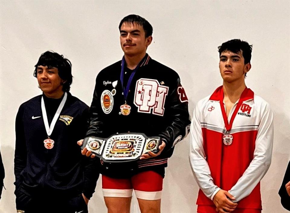 Oak Hills' Dylan Bentz poses with his 170-pound title at the Downey 32 tournament over the weekend.