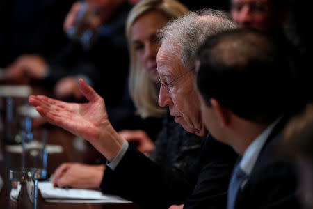 U.S. Senator Chuck Grassley (R-IA) speaks to President Donald Trump during a bipartisan meeting with legislators on immigration reform at the White House in Washington, U.S. January 9, 2018. REUTERS/Jonathan Ernst