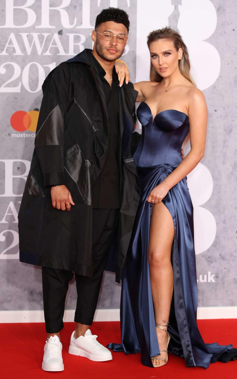 Alex Oxlade-Chamberlain and Perrie Edwards attend The BRIT Awards 2019 held at The O2 Arena on February 20, 2019 in London, England