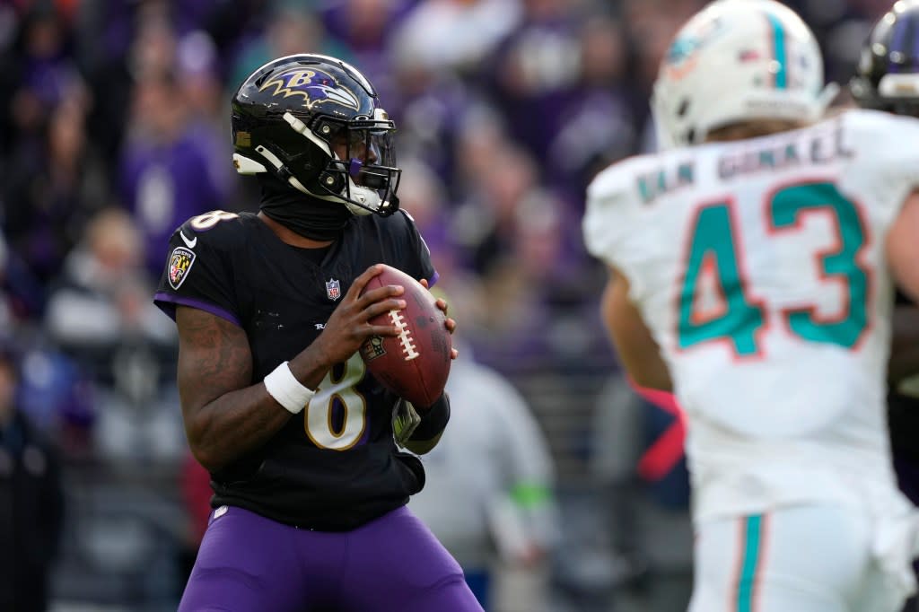 Baltimore Ravens quarterback Lamar Jackson (8) looks to pass under pressure from Miami Dolphins linebacker Andrew Van Ginkel (43) during the second half of an NFL football game in Baltimore, Sunday, Dec. 31, 2023. (AP Photo/Matt Rourke)