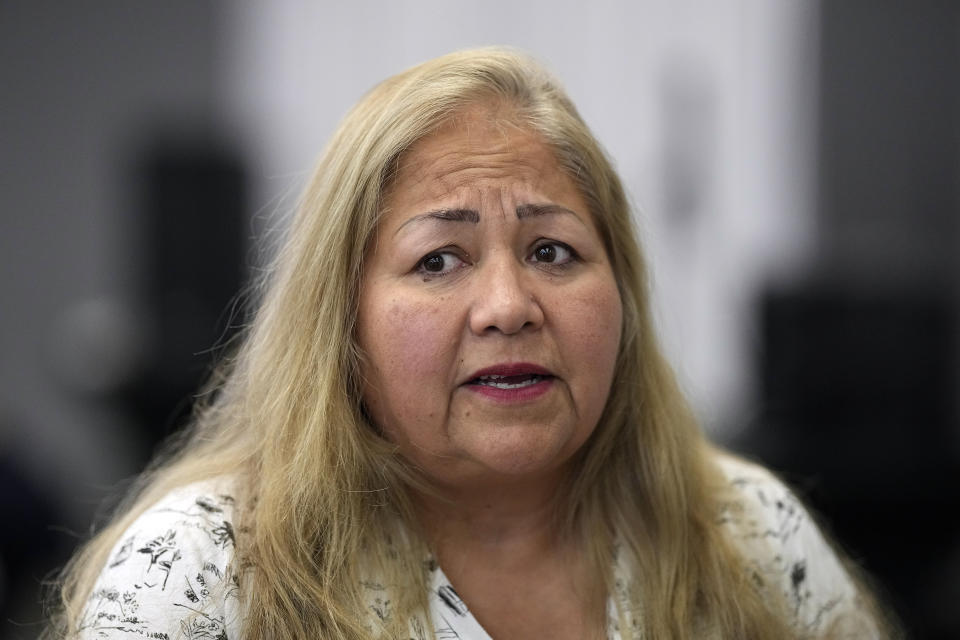 Maria Trevino talks about crime in her neighborhood during a National Crime Prevention Council workshop Thursday, Sept. 29, 2022, in Houston. (AP Photo/David J. Phillip)