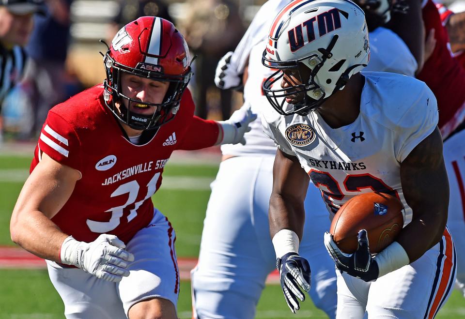 UT Martin's Peyton Logan tries to evade the tackle of Jacksonville State's Hudson Petty during college football action at Burgess-Snow Field Jacksonville State Stadium in Jacksonville, Alabama September 25, 2021. (Dave Hyatt: The Gadsden Times)