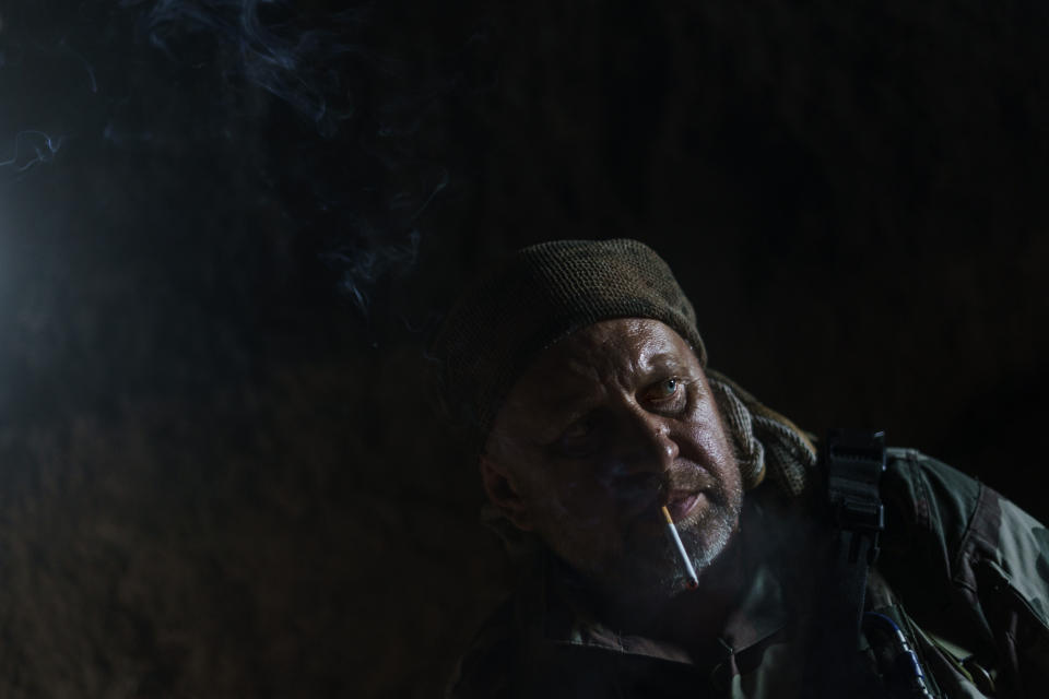 Sgt. Maj. Artur Shevtsov with the Dnipro-1 regiment tours a bunker at their position during a period of relative calm near Sloviansk, Donetsk region, eastern Ukraine, Friday, Aug. 5, 2022. Sgt. Maj. Shevtsov said that the provision of heavy weapons from Ukraine's western allies had helped keep some Donbas cities like Sloviansk relatively safe since their delivery in June. But such weapons have likely only bought time for Ukrainian forces, he said, adding that the lack of strikes in the last week "worries me." (AP Photo/David Goldman)