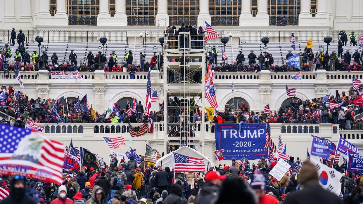 Insurrectionists loyal to President Donald Trump breach the Capitol in Washington, Jan. 6, 2021. 