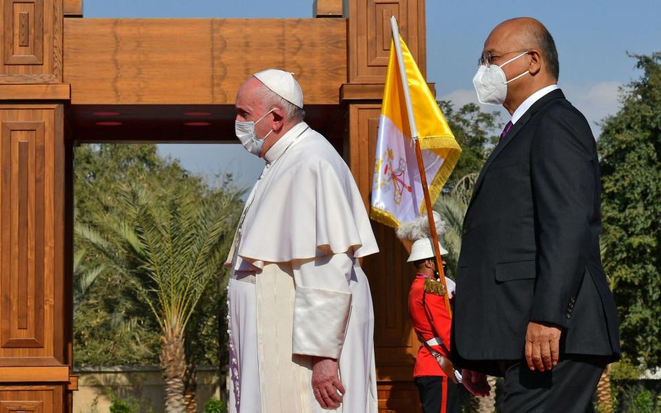 Pope Francis is welcomed by Iraqi President Barham Saleh at the presidential palace in Baghdad - Vincenzo Pinto/AFP