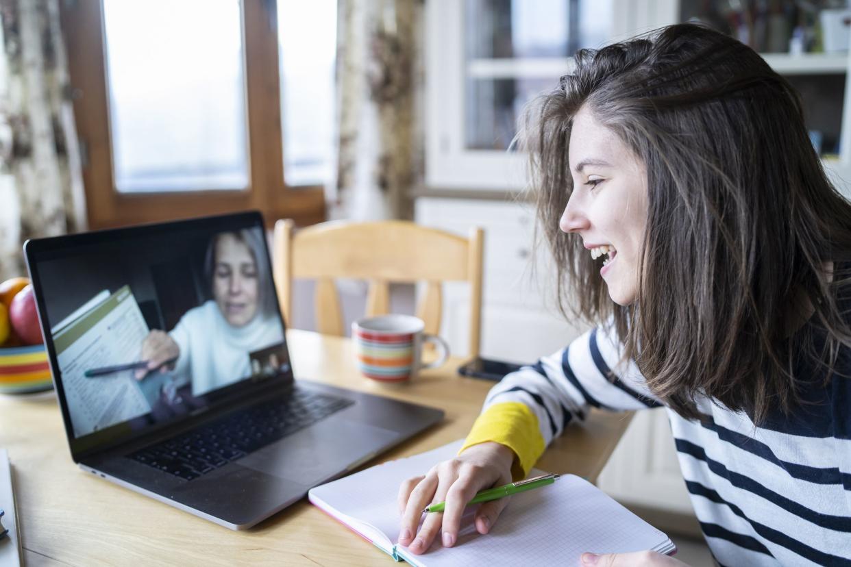 Woman tutoring a student online