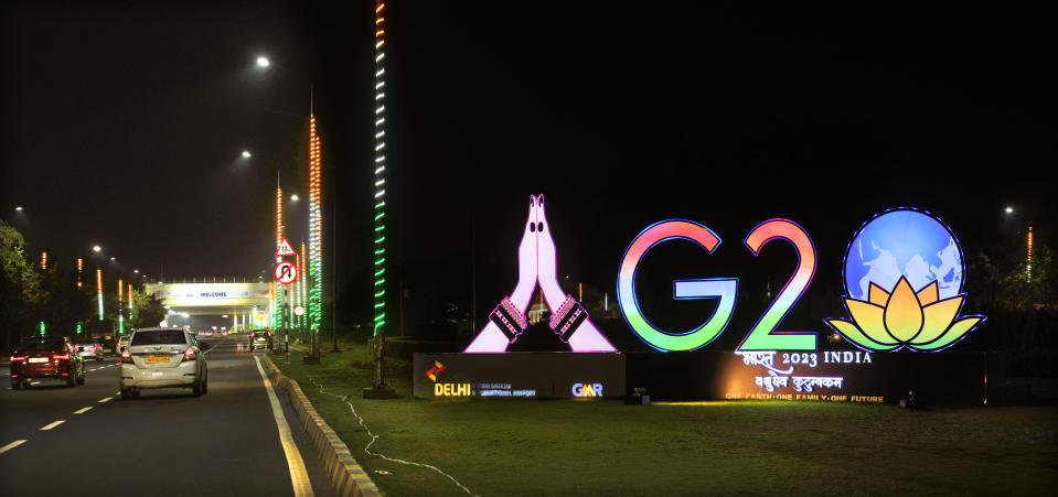 Traffics moves past an illuminated G20 logo near the airport ahead of this week’s summit of the Group of 20 nations in New Delhi, India, Wednesday, Sept. 6, 2023. (AP Photo/Manish Swarup)