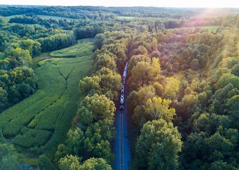 'They had timetables and intervals of their own, drawing growth rings around our house with each journey, ringing past us like prayer chimes' - Credit: Getty