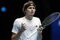 Alexander Zverev of Germany reacts as he plays against Novak Djokovic of Serbia during their singles tennis match at the ATP World Finals tennis tournament at the O2 arena in London, Friday, Nov. 20, 2020. (AP Photo/Frank Augstein)