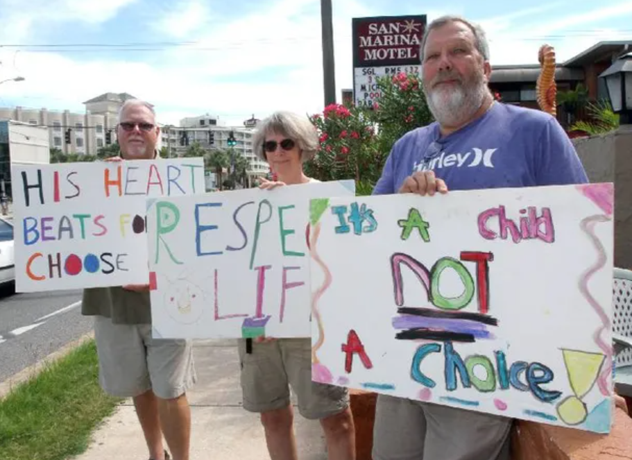 Abortion opponents urge people to respect the life of an unborn child at a rally in Ormond Beach in 2011.