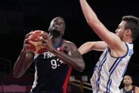 France's Moustapha Fall (93) drives to the basket against Italy's Danilo Gallinari (8) during a men's basketball quarterfinal round game at the 2020 Summer Olympics, Tuesday, Aug. 3, 2021, in Saitama, Japan. (AP Photo/Eric Gay)