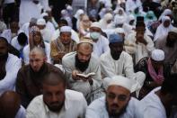 A Muslim pilgrim reads the Koran as he attends Friday prayers at the Grand mosque in the holy city of Mecca ahead of the annual haj pilgrimage October 11, 2013. REUTERS/Ibraheem Abu Mustafa (SAUDI ARABIA - Tags: RELIGION)