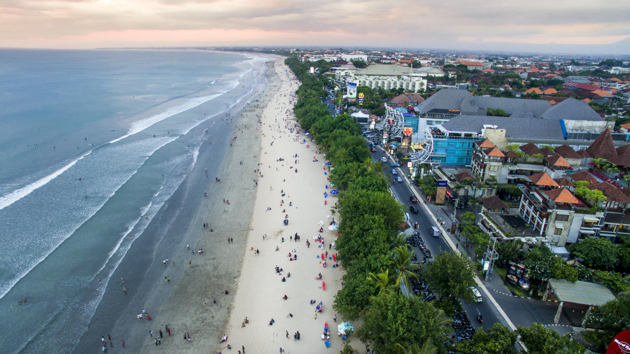 Views overlooking the crowded Kuta Beach in Bali.