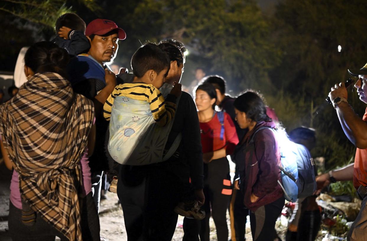 Asylum-seekers at the Rio Grande near the U.S.-Mexico border in Matamoros, Mexico, on May 11, 2023. <a href="https://www.gettyimages.com/detail/news-photo/members-of-the-mexican-governments-beta-group-a-service-by-news-photo/1253931390?adppopup=true" rel="nofollow noopener" target="_blank" data-ylk="slk:Alfredo Estrella/AFP via Getty Images;elm:context_link;itc:0;sec:content-canvas" class="link ">Alfredo Estrella/AFP via Getty Images</a>