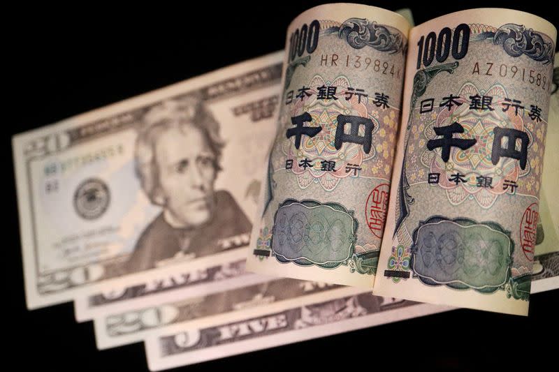 FILE PHOTO: Illustration picture of Japanese yen and U.S. dollar banknotes