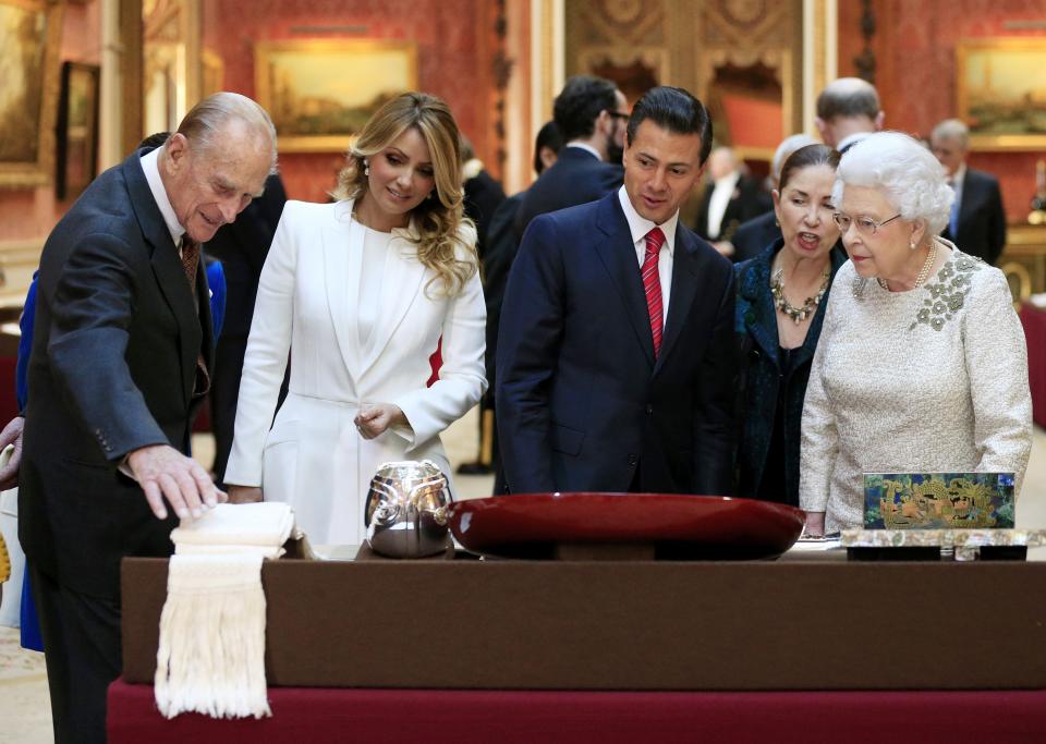 Britain's Prince Phillip and First Lady of Mexico Angela Rivera, Mexico's President Enrique Pena Nieto and Britain's Queen Elizabeth view a display of Mexican items in the Royal Collection by at Buckingham Palace, London