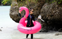 <p>A tourist frolics in Tumon beach on the island of Guam, a U.S. Pacific Territory, August 10, 2017. (Erik De Castro/Reuters) </p>