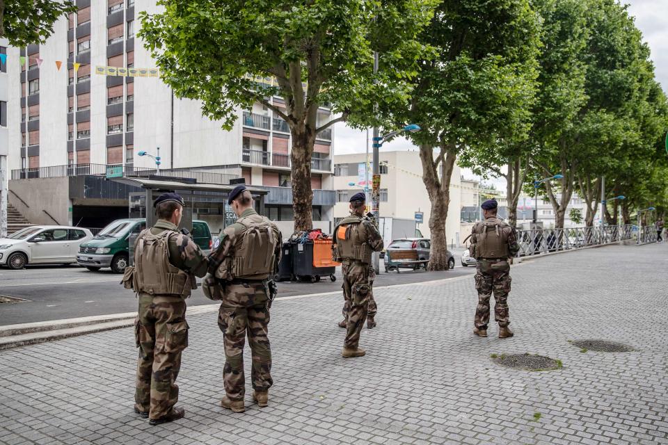 French soldiers patrol streets in the Jewish quarter of Sarcelles, France. Jews and Arab immigrants have lived alongside each other in the area for decades. | Magnus Wennman for TIME