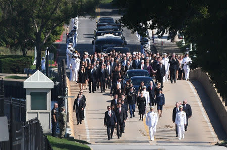 A hearse containing the body of the late Senator John McCain arrives for a private memorial service and burial at the U.S. Naval Academy in Annapolis, U.S., September 2, 2018. REUTERS/Mary F. Calvert