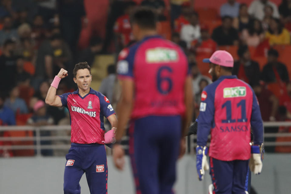 Rajasthan Royals' Trent Boult, left, celebrates the dismissal of Punjab Kings' Ashutosh Sharma during the Indian Premier League cricket match between Punjab Kings and Rajasthan Royals in Mohali, India, Saturday, April 13, 2024. (AP Photo/Surjeet Yadav)