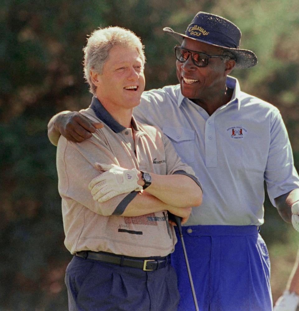 Vernon Jordan, photographed with President Bill Clinton on the golf course in Martha's Vineyard in August 1993, was a trusted adviser to the president.