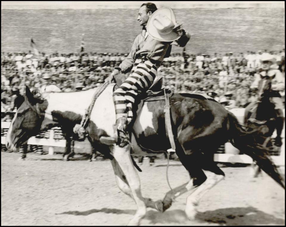 An inmate competes in bronc riding in the 1941 prison rodeo at the Oklahoma State Penitentiary in McAlester.