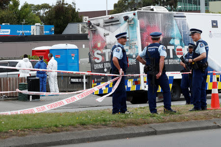 Investigators at the site of Friday's shooting outside the Linwood Mosque in Christchurch, New Zealand March 18, 2019. REUTERS/Edgar Su