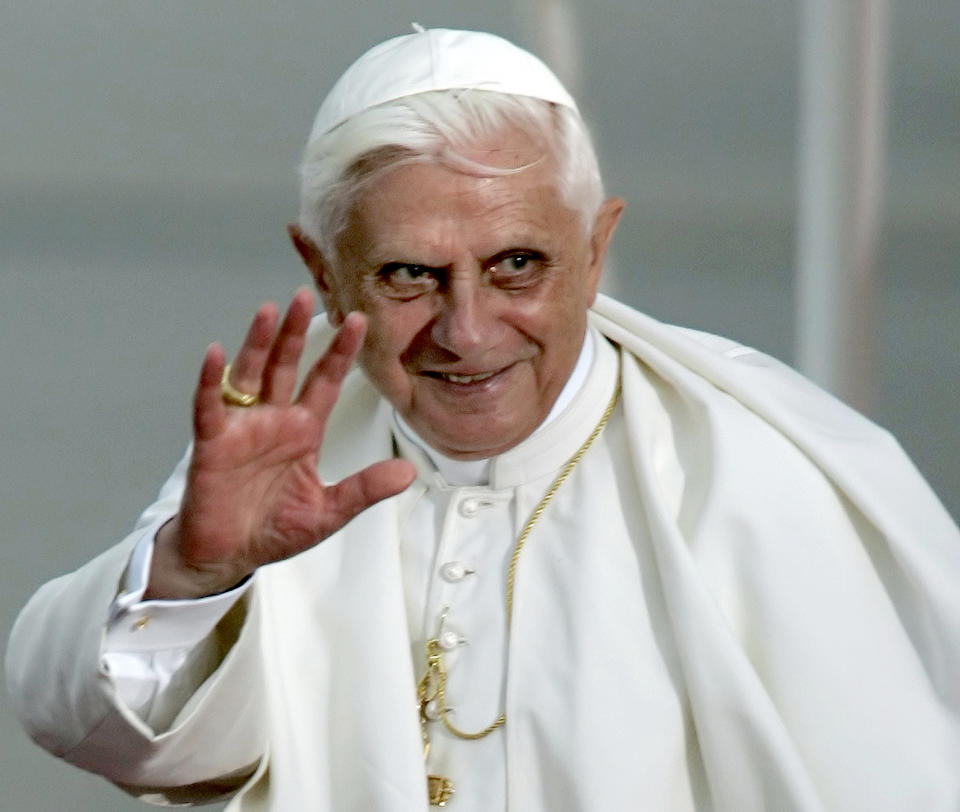 FILE - Pope Benedict XVI waves during the farewell ceremony at Cologne airport, Germany, on Aug. 21, 2005. Pope Benedict XVI was on his first foreign trip as pontiff and took part in the World Youth Day 2005 in Cologne. When Cardinal Joseph Ratzinger became Pope Benedict XVI and was thrust into the footsteps of his beloved and charismatic predecessor, he said he felt a guillotine had come down on him. The Vatican announced Saturday Dec. 31, 2022 that Benedict, the former Joseph Ratzinger, had died at age 95. (AP Photo/Eckehard Schulz, File)