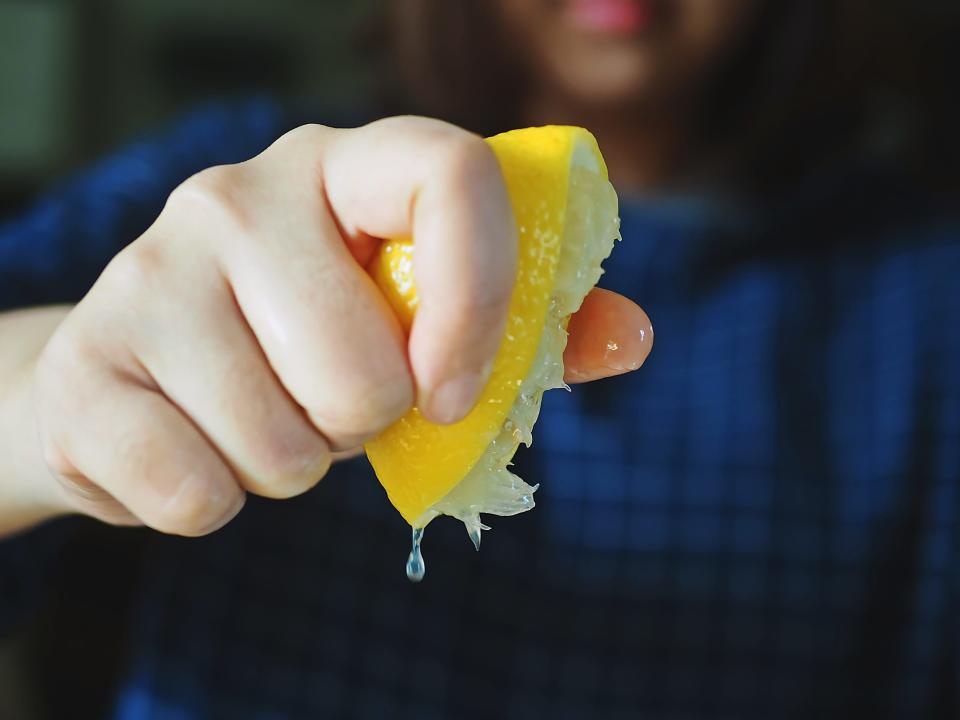 lemon woman squeezing lemon