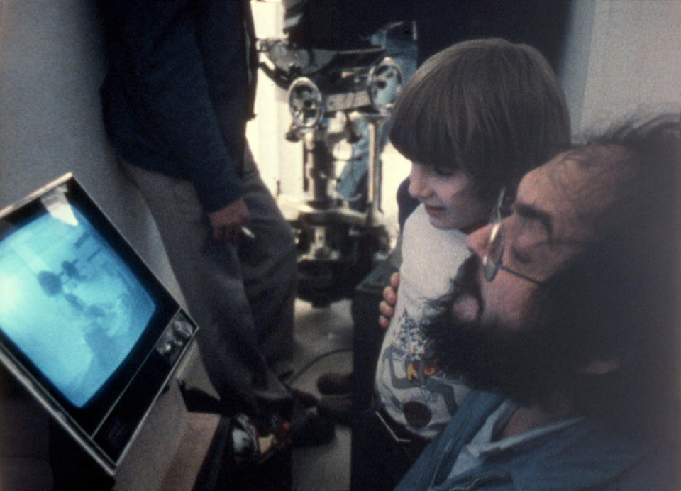 Danny looking at film footage with Stanley Kubrick, The Shining director