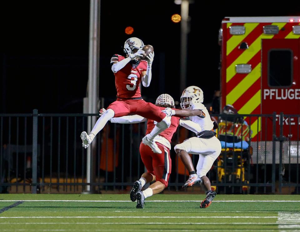 Weiss' Peyton Morgan, intercepting a pass against Hutto, will play at Texas Tech next season. He had 72 tackles this year.