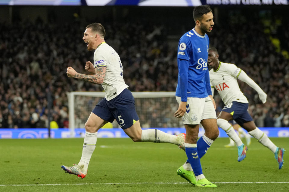 Tottenham's Pierre-Emile Hojbjerg, left, celebrates after scoring his side's second goal during the English Premier League soccer match between Tottenham Hotspur and Everton at the Tottenham Hotspur Stadium in London, England, Saturday, Oct. 15, 2022. (AP Photo/Kin Cheung)