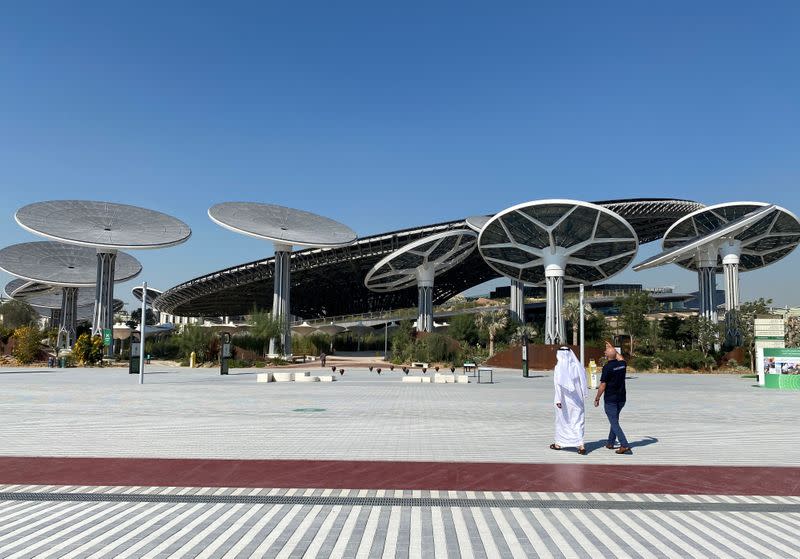 People walk at the site of Dubai Expo 2020 in Dubai