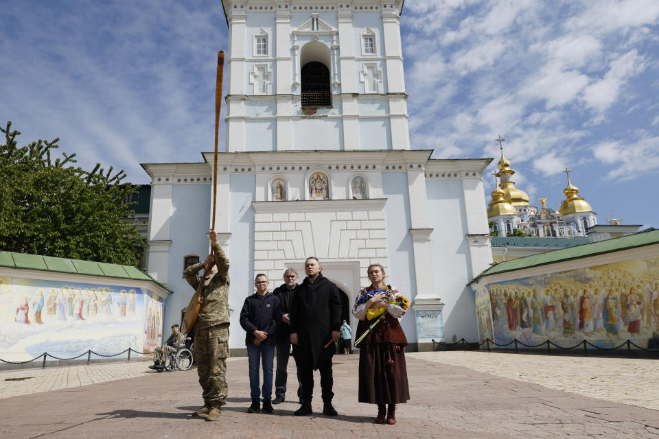 Ivanka Sanina, right, reacts during a farewell ceremony for her groom, U.S. volunteer soldier Christopher James Campbell in Kyiv, Ukraine, Friday, May 5, 2023. Campbell was a member of the International Legion and ex-soldier of the U.S. 82nd Airborne Division. He recently died in Bakhmut during fightings against Russian forces. (AP photo/Alex Babenko)