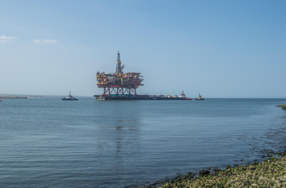 The 17,000 tonne Brent Alpha Topside Oil Rig is brought into the River Tees on the Allseas 200m long wide cargo barge the Iron Lady at South Gare, Redcar for dismantling at the Able UK yard, Hartlepool, County Durham, UK, on June 24, 2020. (Photo by Trevor Wilkinson/MI News/NurPhoto via Getty Images)