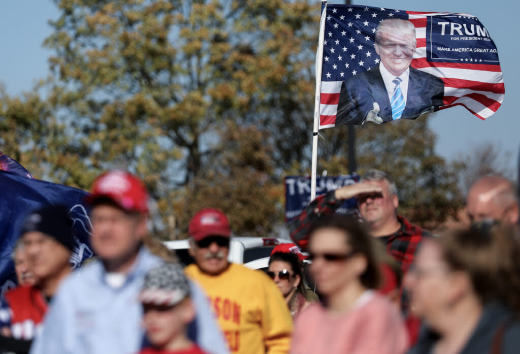 A Donald Trump flag waves in the breeze as supporters of President Trump gather for a ‘Trump Parade’ in the battleground state of Iowa on October 31, 2020 in Madrid, Iowa. (Photo by Mario Tama/Getty Images)