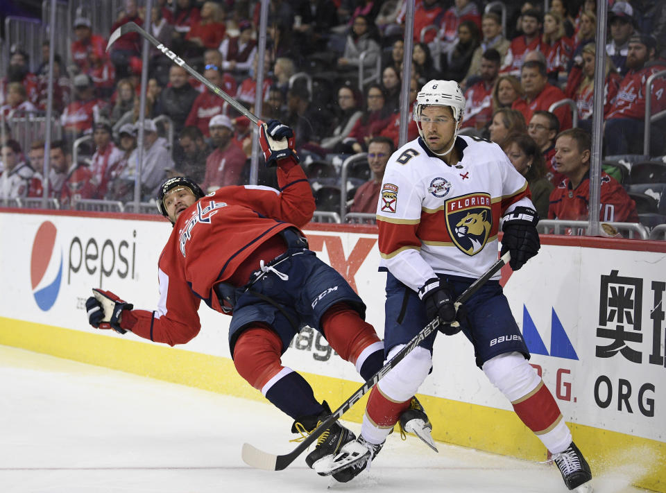 Washington Capitals left wing Alex Ovechkin, left, of Russia, collides with Florida Panthers defenseman Alexander Petrovic (6) during the second period of an NHL hockey game, Friday, Oct. 19, 2018, in Washington. (AP Photo/Nick Wass)