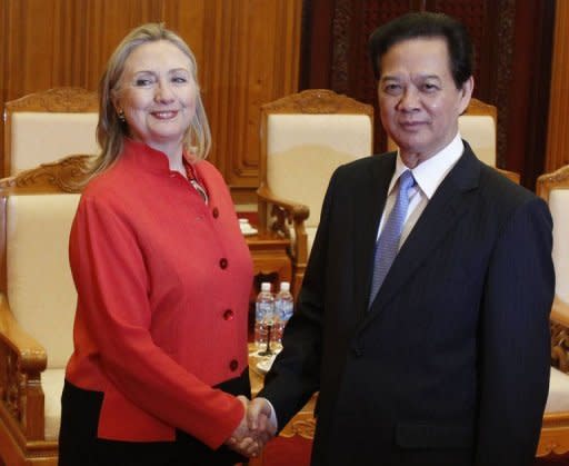 US Secretary of State Hillary Clinton (L) and Vietnam's Prime Minister Nguyen Tan Dung shake hands at the Government Office in Hanoi. Clinton made a strong push for improved human rights