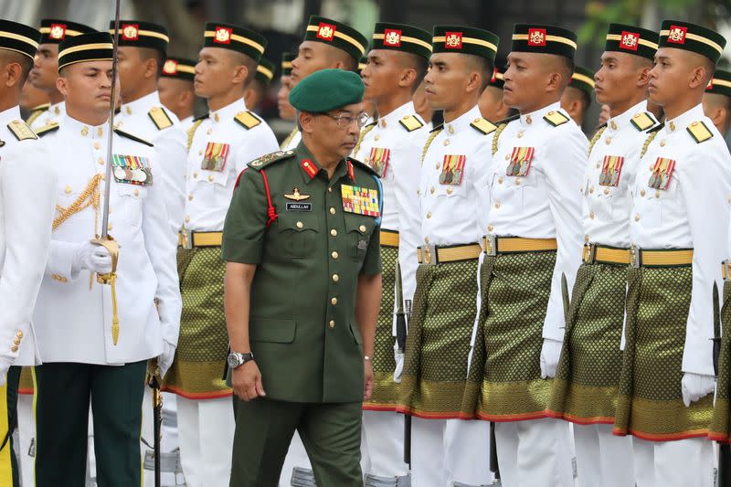 FILE PHOTO: Malaysia's King, Al-Sultan Abdullah Ri’ayatuddin Al-Mustafa Billah Shah, inspects an honour guard during the 62nd Merdeka Day (Independence Day) celebrations in Putrajaya.