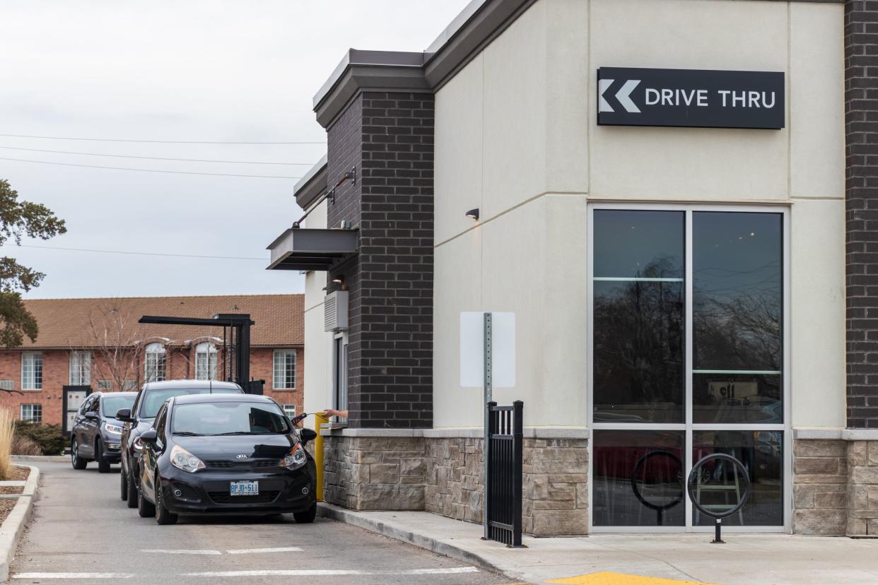 Vehicles in the drive-thru at a Starbucks Coffee location using drive-thru pick up only due to the ongoing COVID-19 Pandemic. (Brantford, Ontario)