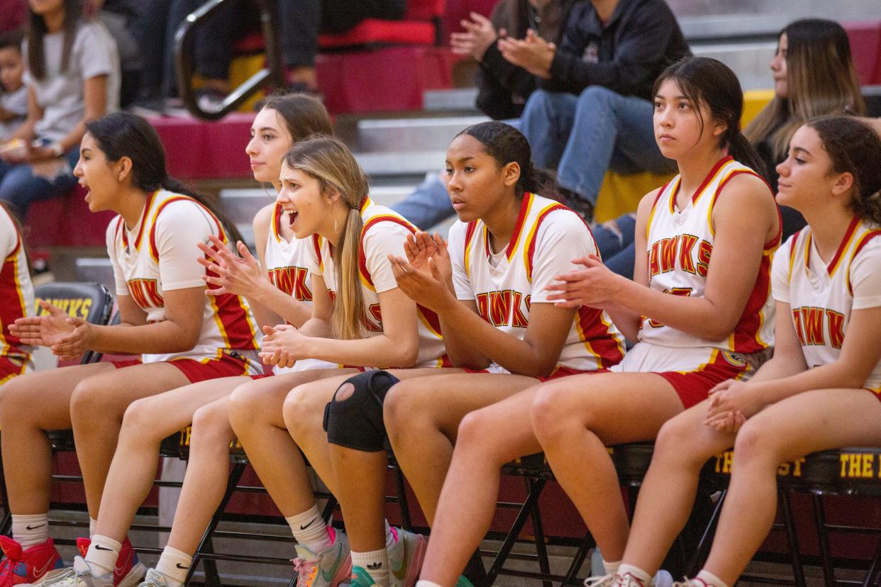 The CHS girls basketball team cheers for their teammates during the girls basketball district tournament championship game on Saturday, Feb. 25, 2023, at Centennial High School.