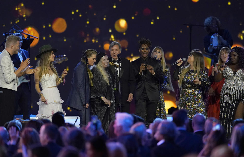 Joni Mitchell, fourth from left, and artists perform "Big Yellow Taxi" at the conclusion of the 31st annual MusiCares Person of the Year benefit gala honoring Mitchell on Friday, April 1, 2022, at the MGM Grand Conference Center in Las Vegas. (AP Photo/Chris Pizzello)