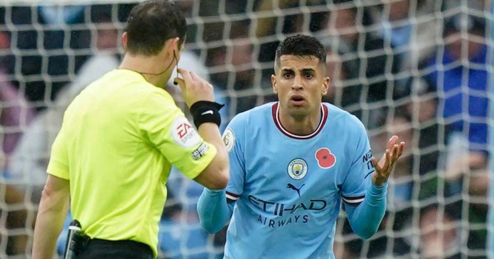 Manchester City's Joao Cancelo gestures to Referee Darren England after conceding a penalty and being sent off during the English Premier League soccer match between Manchester City and Fulham at Etihad stadium in Manchester, England, Saturday, Nov. 5, 2022 Credit: Alamy