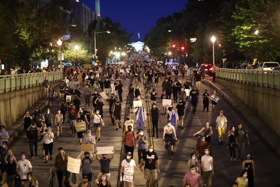 Demonstrators marched away from the White House last night, ignoring the curfew (Getty Images)