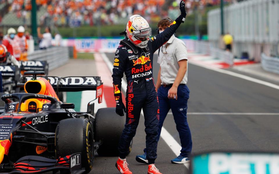 Max Verstappen of Netherlands and Red Bull Racing waves to the crowd in parc ferme during the F1 Grand Prix of Hungary at Hungaroring on August 01, 2021 in Budapest, Hungary