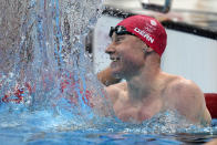 Tom Dean of Britain celebrates after winning the final of the men's 200-meter freestyle at the 2020 Summer Olympics, Tuesday, July 27, 2021, in Tokyo, Japan. (AP Photo/Martin Meissner)