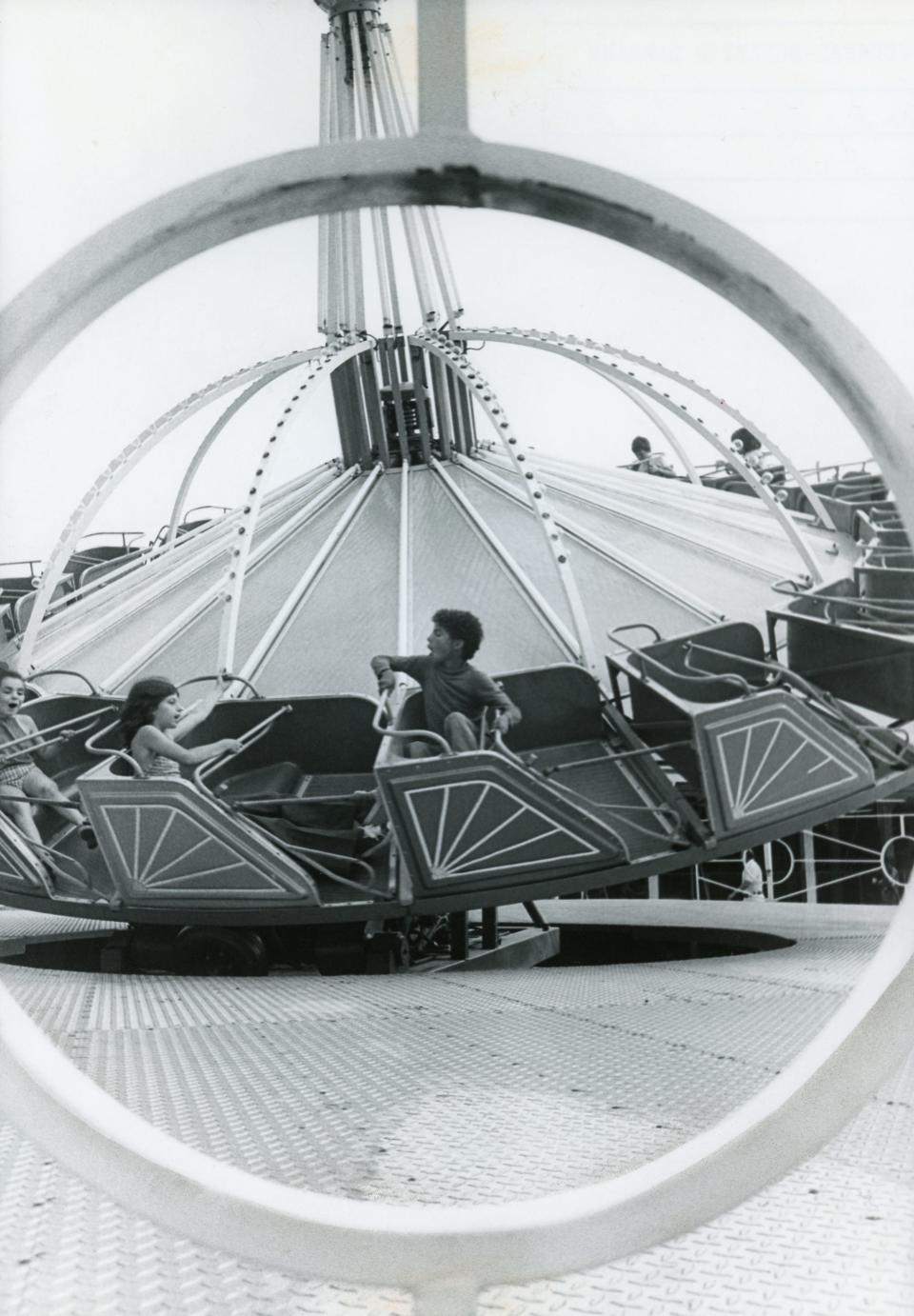 Patrons enjoy a ride at Rocky Point Park in 1974.