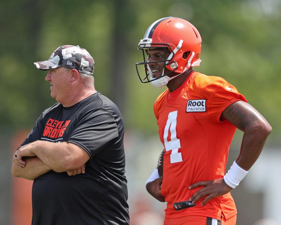 Browns quarterback Deshaun Watson and offensive coordinator Alex Van Pelt watch from the sideline during the 2022 training camp in Berea.